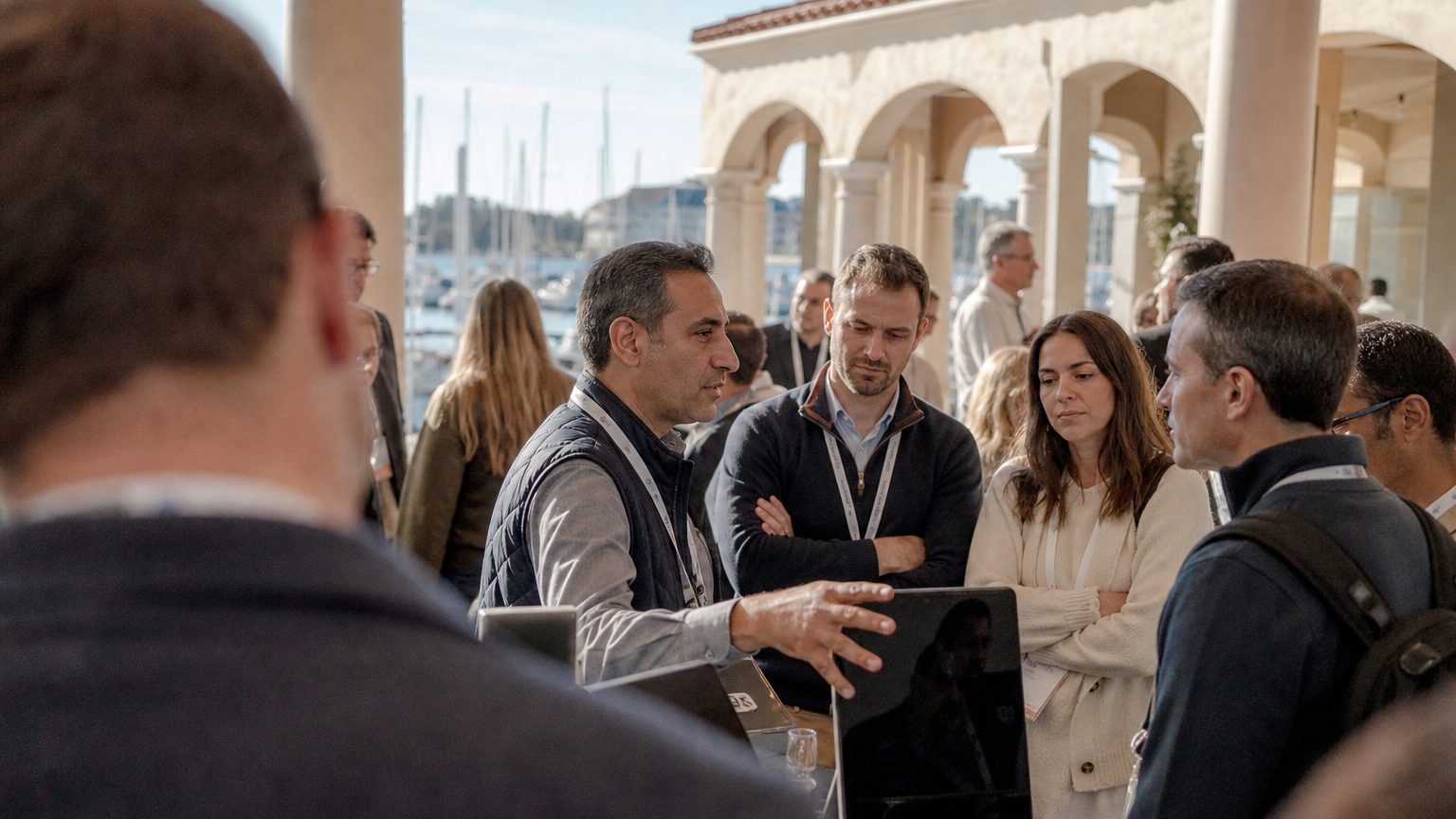 Two brand staff in conversation with attendees at a stand