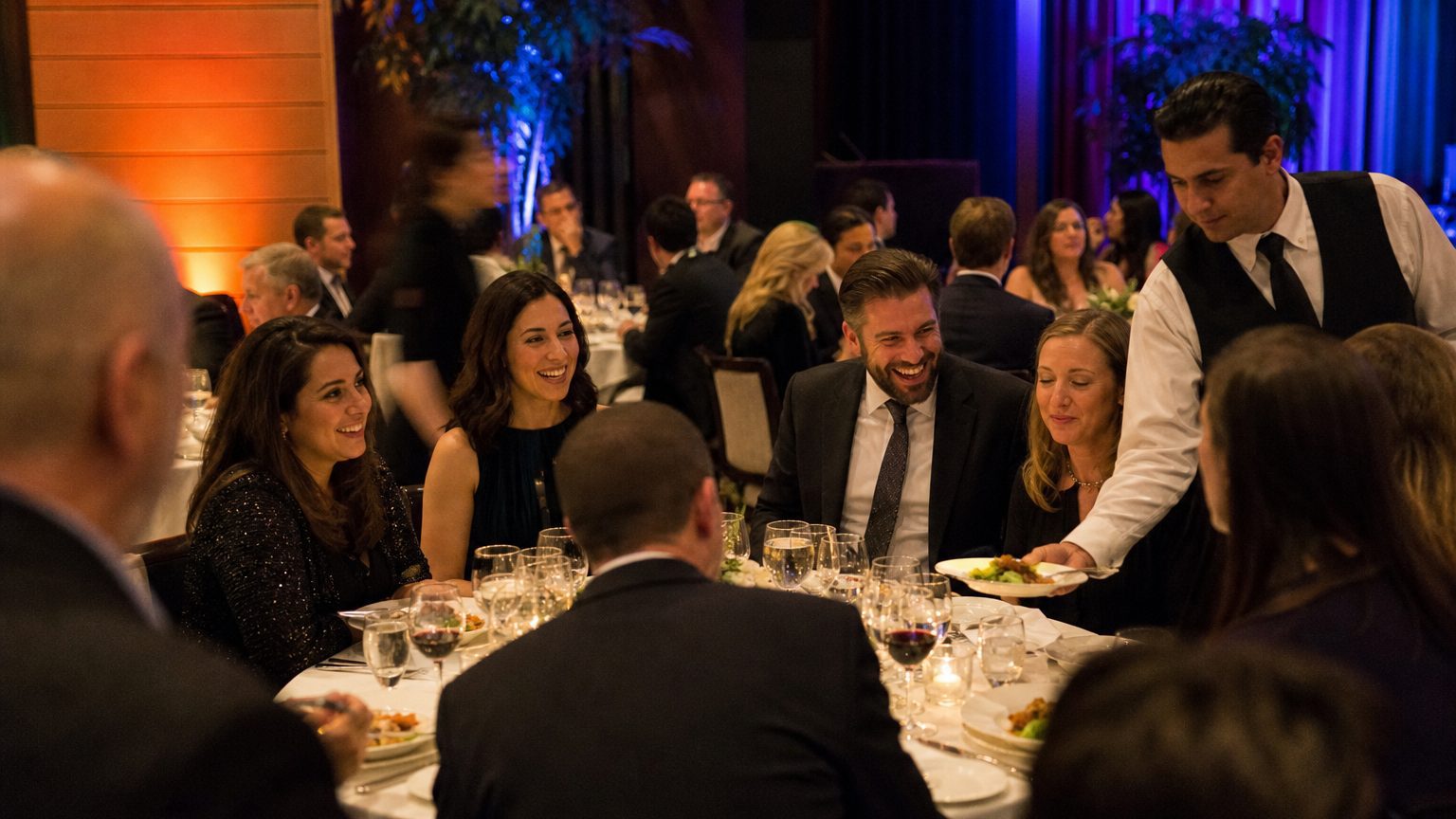 Guests at round tables mid-conversation